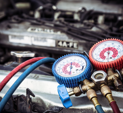 Close up the measuring manifold gauge for filling car air conditing